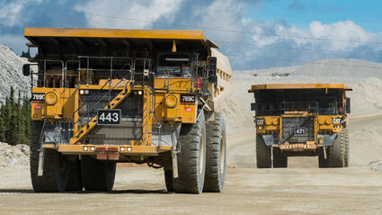 Large Cat haul trucks open pit gold mine Fairbanks Alaska