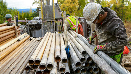 Driller removes core from a drill tube at the Donlin Gold project in Alaska.