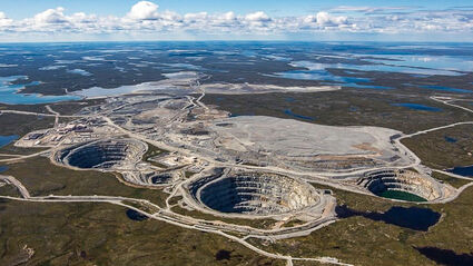 The Ekati diamond mine is surrounded by lakes found on a flat arctic expanse.