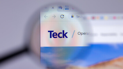 Magnifying glass on the Teck Resources logo displayed on a computer screen.