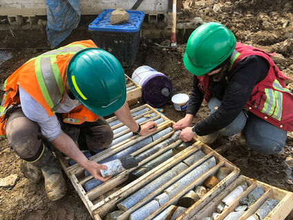 Geotechnicians drill core box Lynx gold discovery hole Yukon