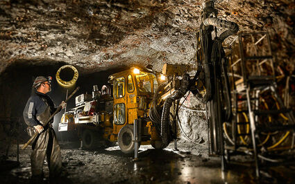 Workers complete underground drilling at the Greens Creek silver mine.
