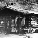 George and Kate Carmack with daughter Graphie at Bonanza Creek cabin, 1897.