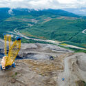 A bird's eye view of the Usibelli coal mine with a massive crane in a pit.