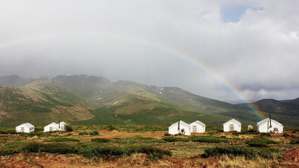 A rainbow shines down on Rockhaven's Klaza camp in the Yukon.